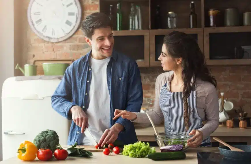 couple making food with vegetables
