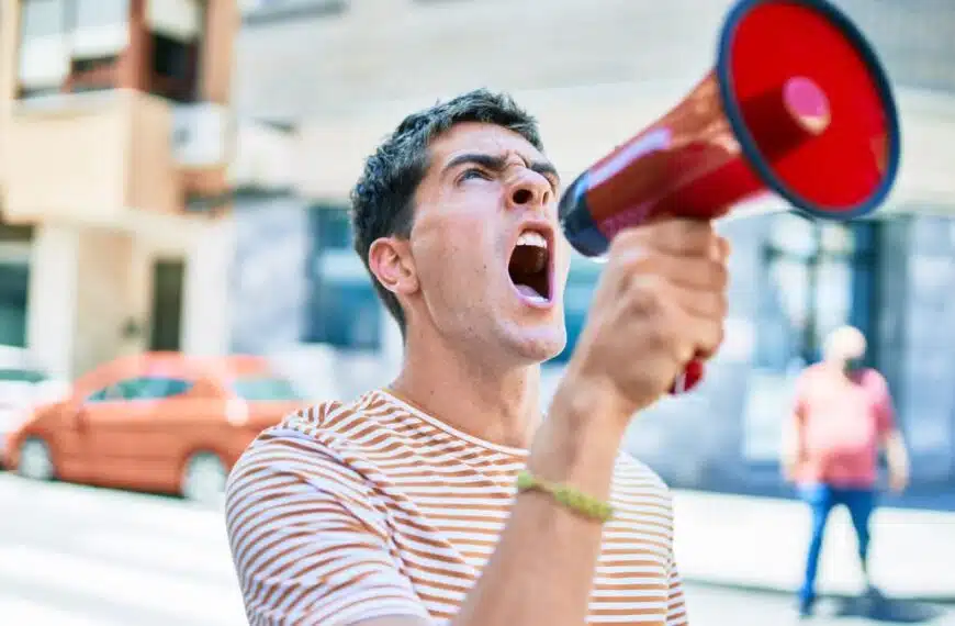 man shouting on a bull horn