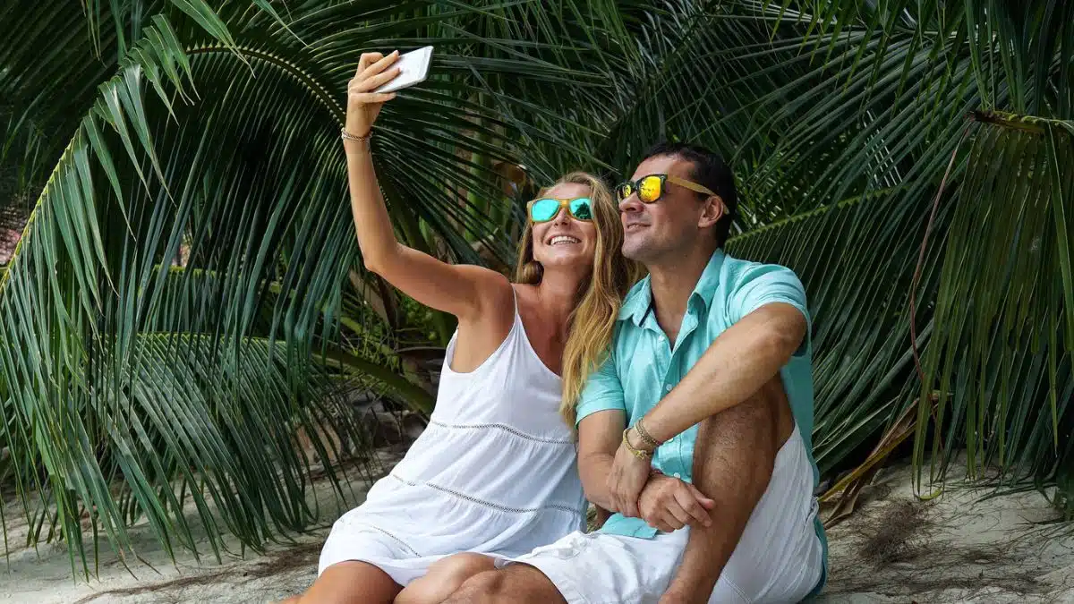 couple taking a picture on the beach