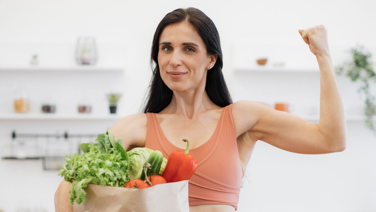 fit woman holding groceries